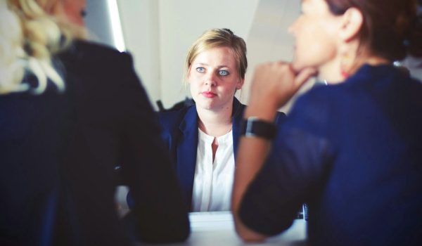 A team in a meeting discussing reports